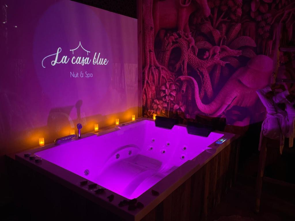 a purple bath tub with lights in a room at SPA La Casa Blue in Wingles