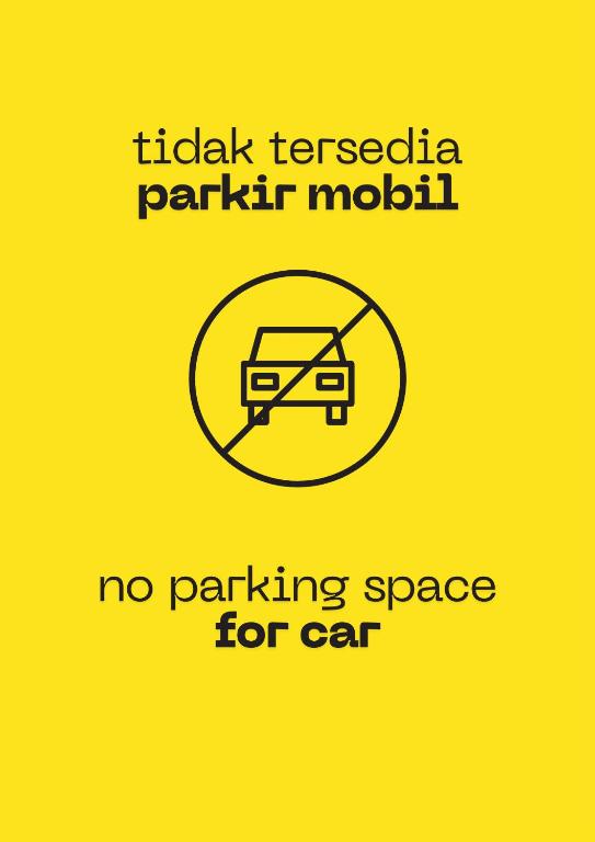 a sign that says no parking space for car at Sela Stay Prawirotaman in Yogyakarta