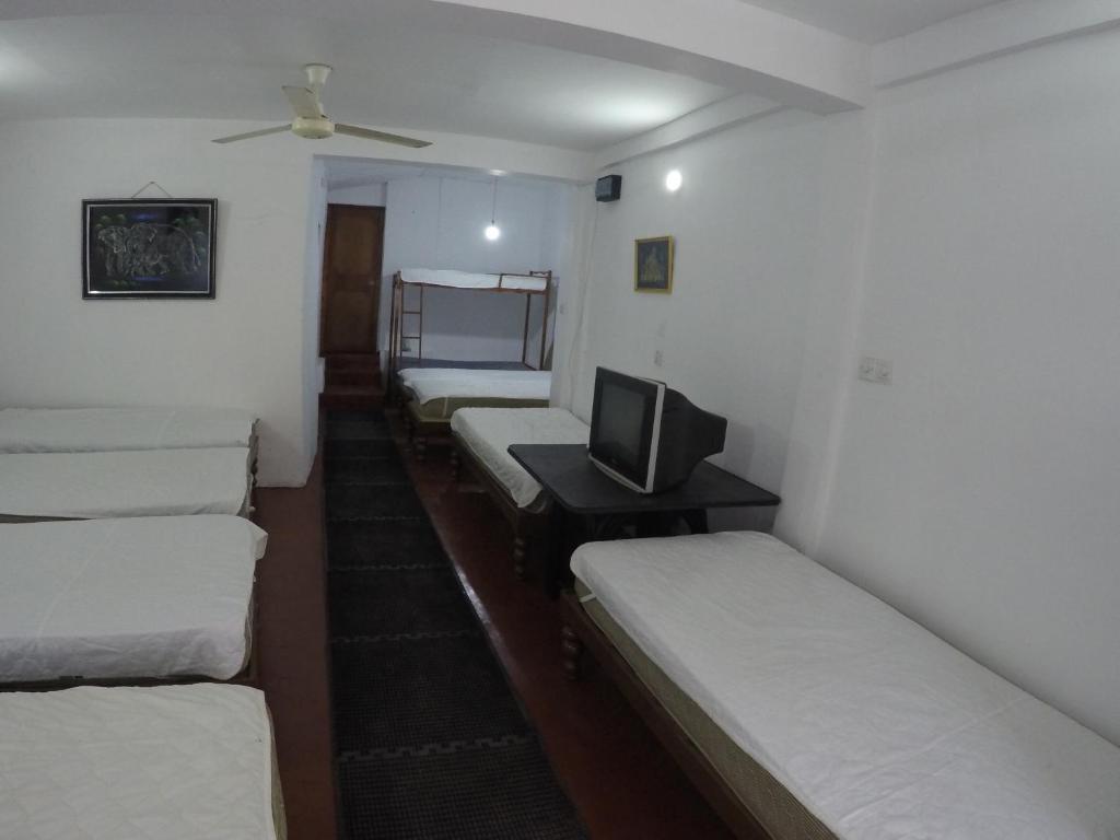 Postel nebo postele na pokoji v ubytování Sizzlers Hub