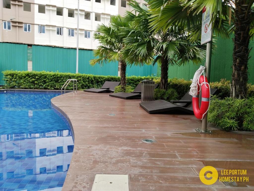 Bazén v ubytování APT at G-207 in SMDC Cheer Residences nebo v jeho okolí