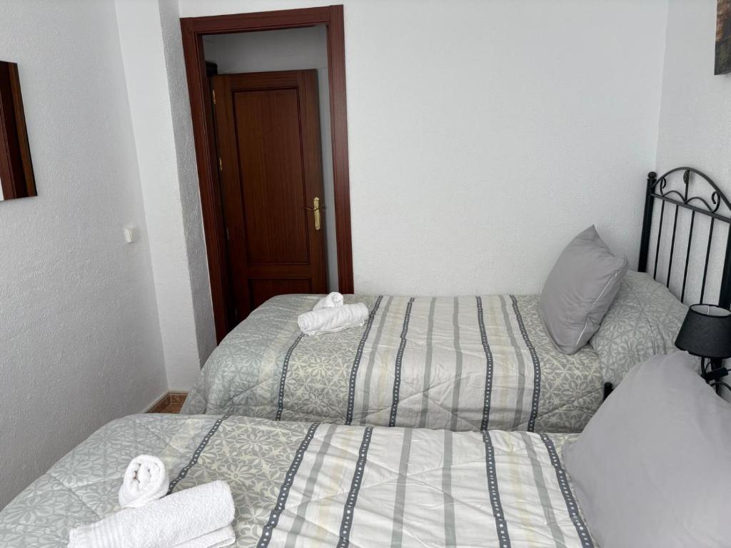 Posteľ alebo postele v izbe v ubytovaní CASA DE ANA