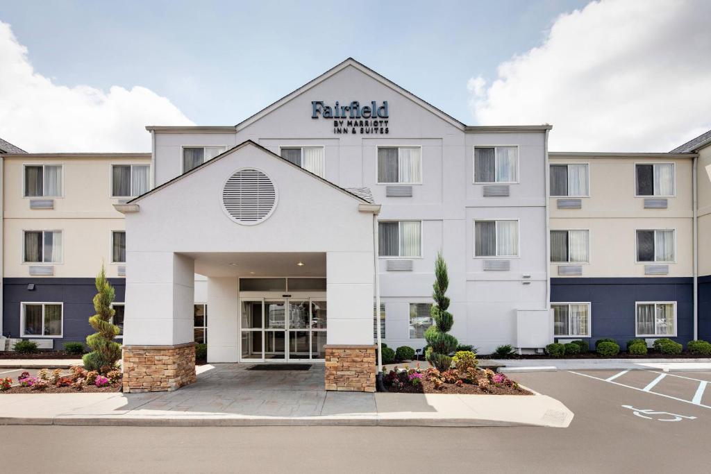 a rendering of the front of a hotel with a parking lot at Fairfield Inn & Suites Indianapolis Airport in Indianapolis