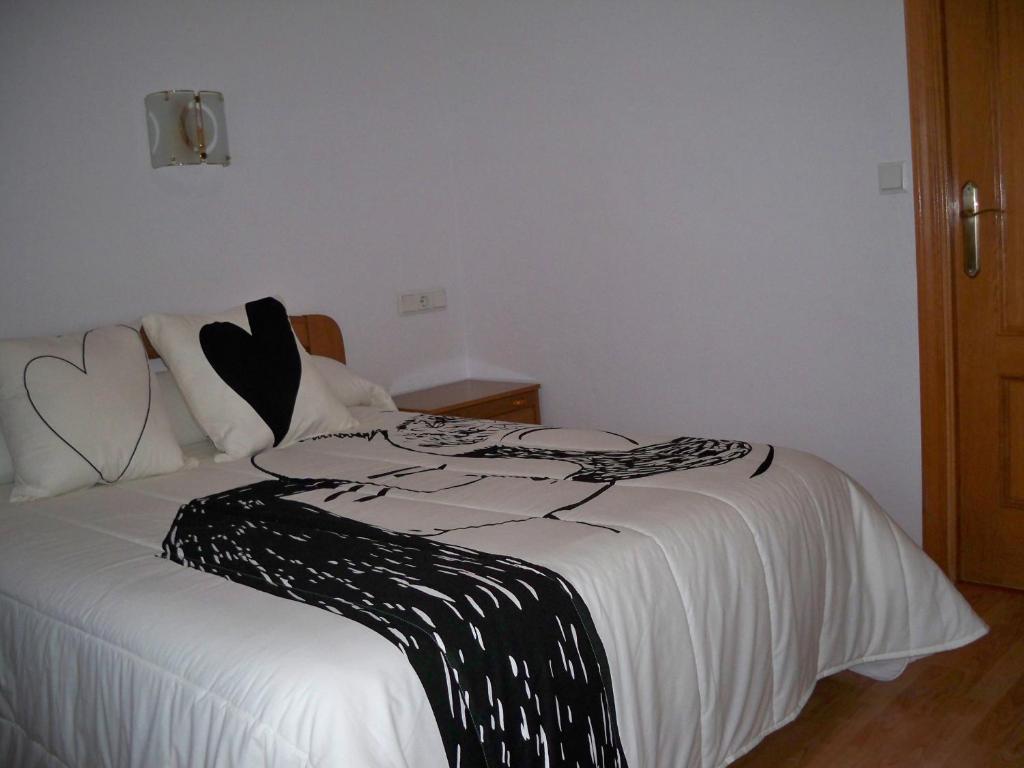 Postel nebo postele na pokoji v ubytování Hostal "Los Chanos el Ruso"