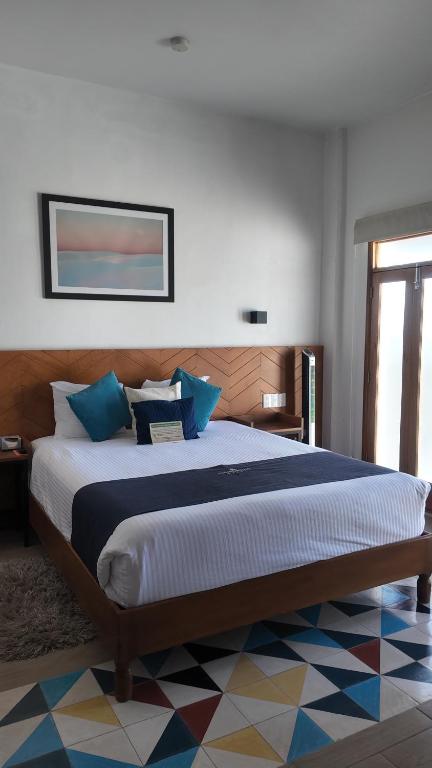 Postel nebo postele na pokoji v ubytování HOTEL CHURUMUCO