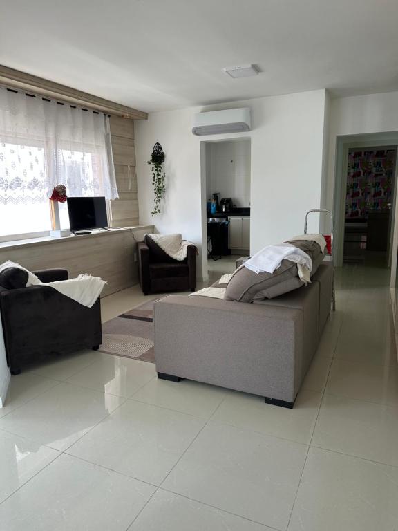 Ένα ή περισσότερα κρεβάτια σε δωμάτιο στο Coração de Capão