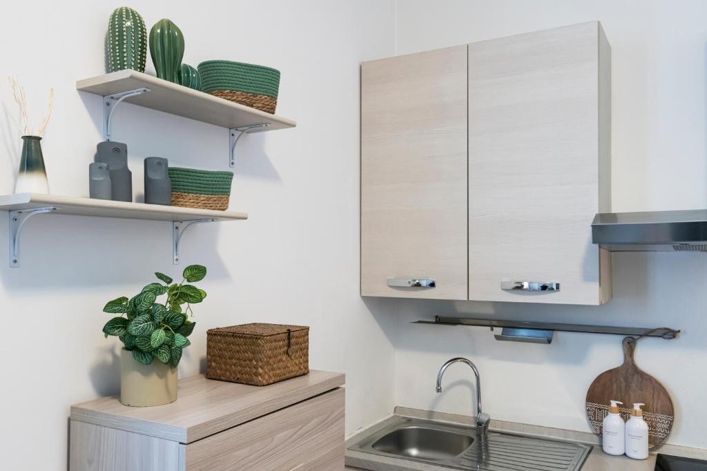 Kuchyňa alebo kuchynka v ubytovaní Cozy apartament in Piazza 5 Giornate by Easylife