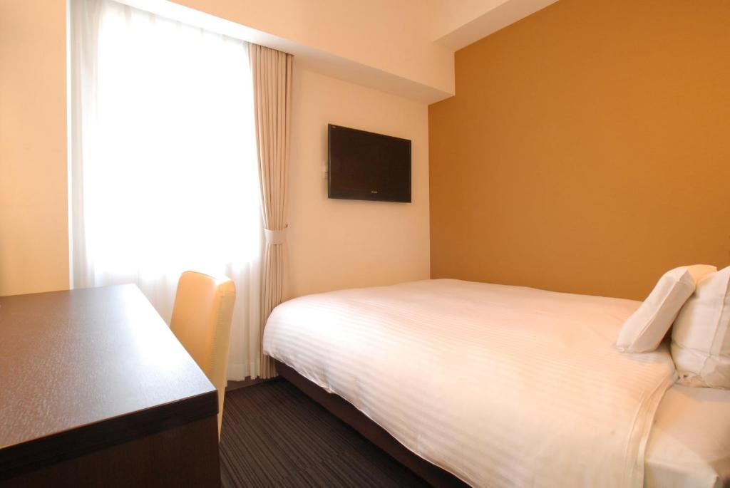 TV a/nebo společenská místnost v ubytování AB Hotel Komaki