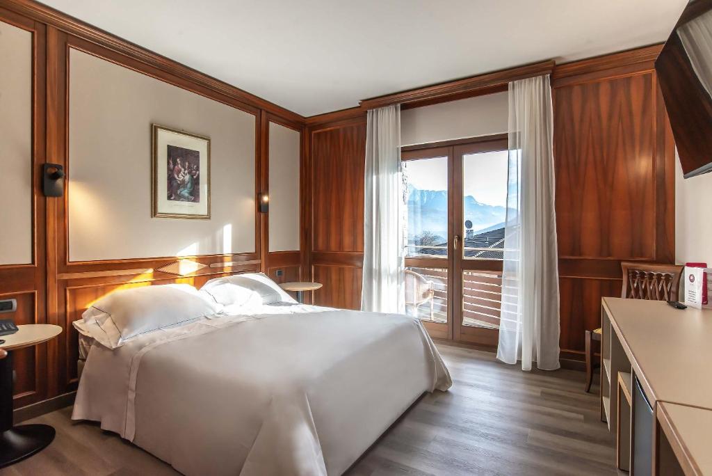 Postel nebo postele na pokoji v ubytování Relais Du Foyer