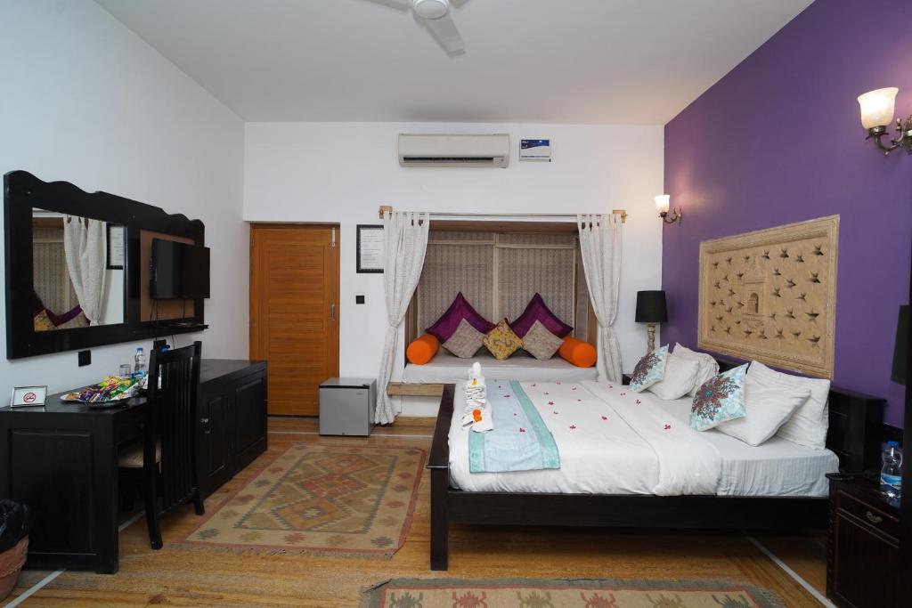 Postel nebo postele na pokoji v ubytování Hotel Jaisan Haveli