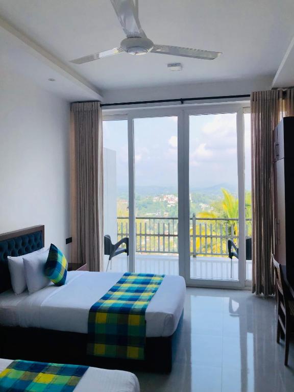 Postel nebo postele na pokoji v ubytování The Cloud Hanthana, Kandy