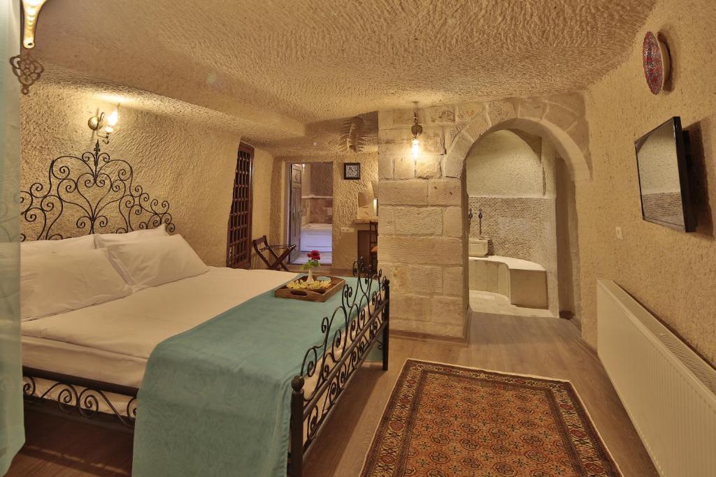 Postel nebo postele na pokoji v ubytování Jacob's Cave Suites - Cappadocia