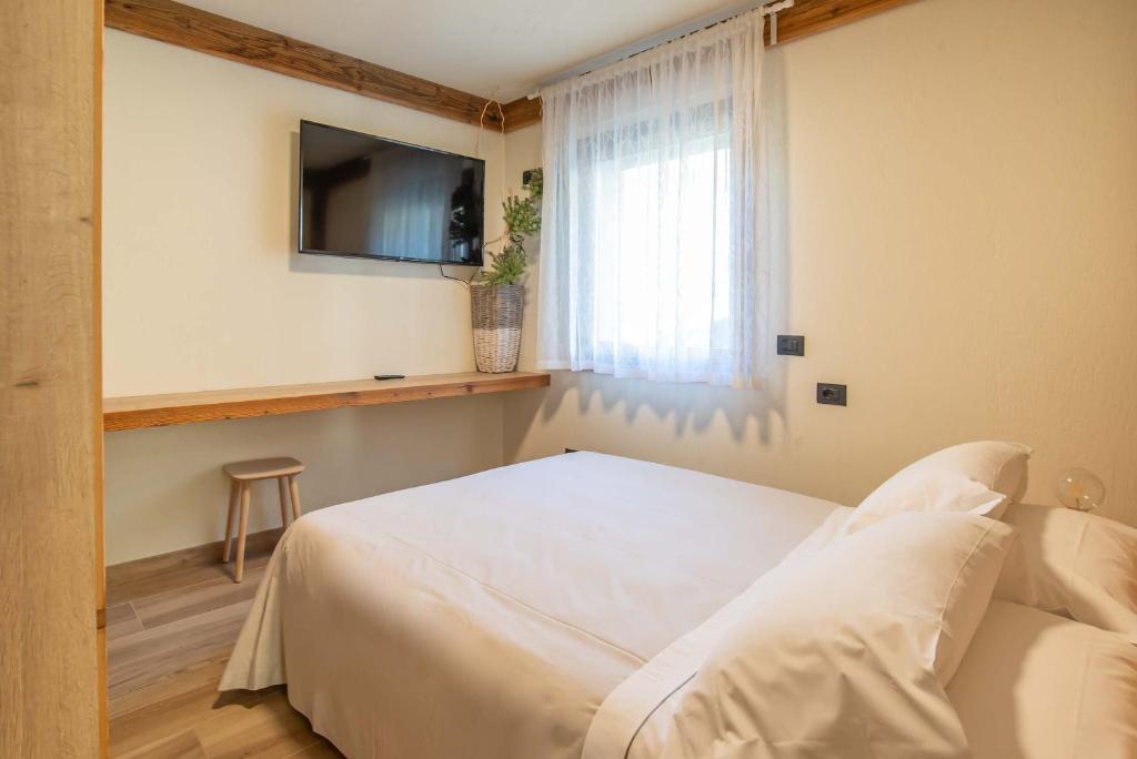 Postel nebo postele na pokoji v ubytování Relais Du Foyer