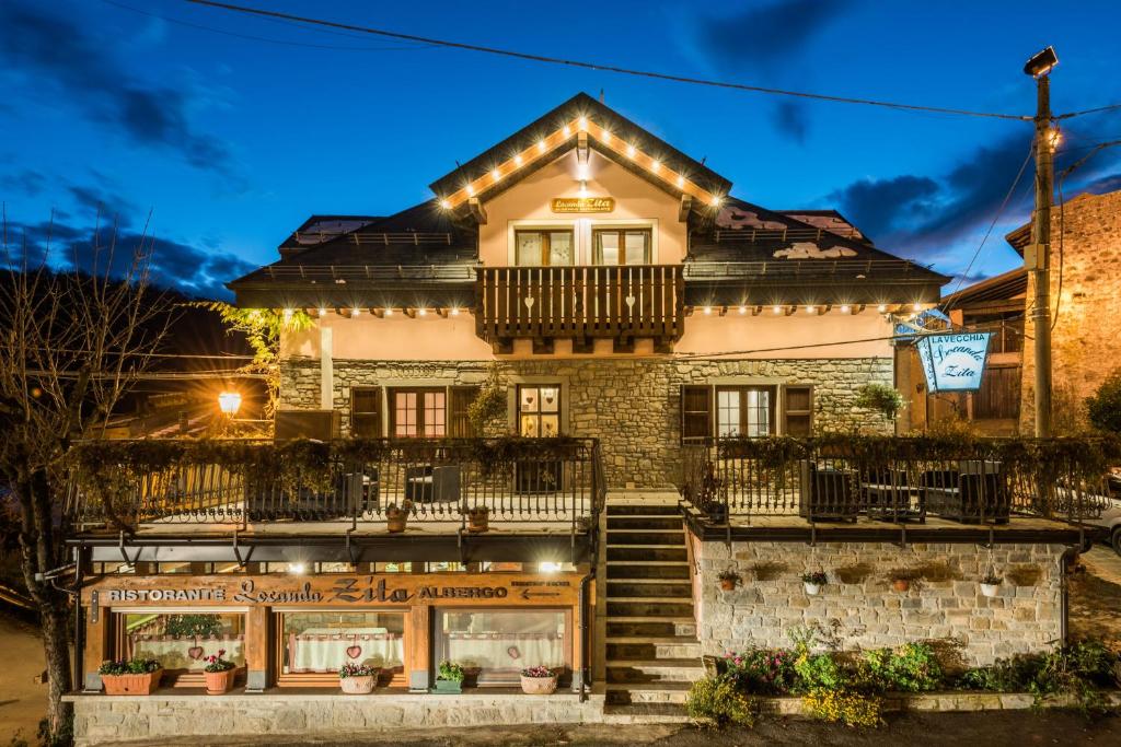 a house with lights on the front of it at Locanda Zita in Sestola