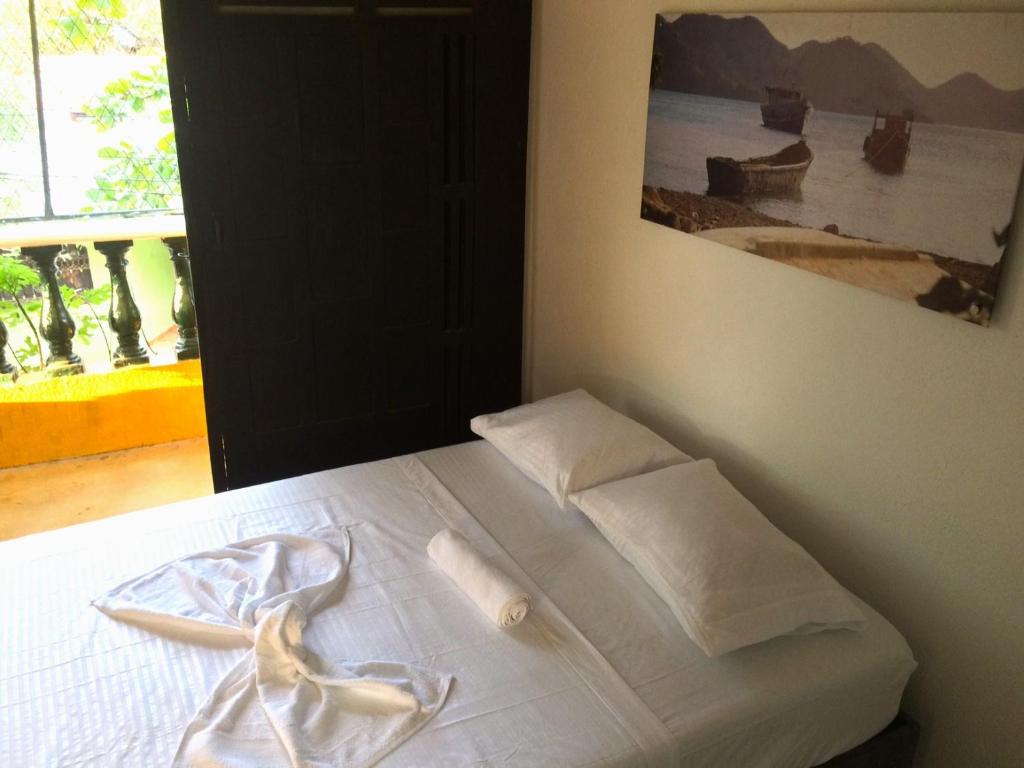 Postel nebo postele na pokoji v ubytování Villa Mary Hostel