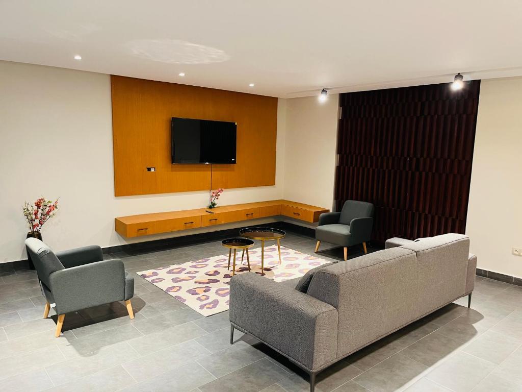 O zonă de relaxare la Villa Torino 2 - moderne et spacieuse avec toutes les commodités pour vous sentir chez vous