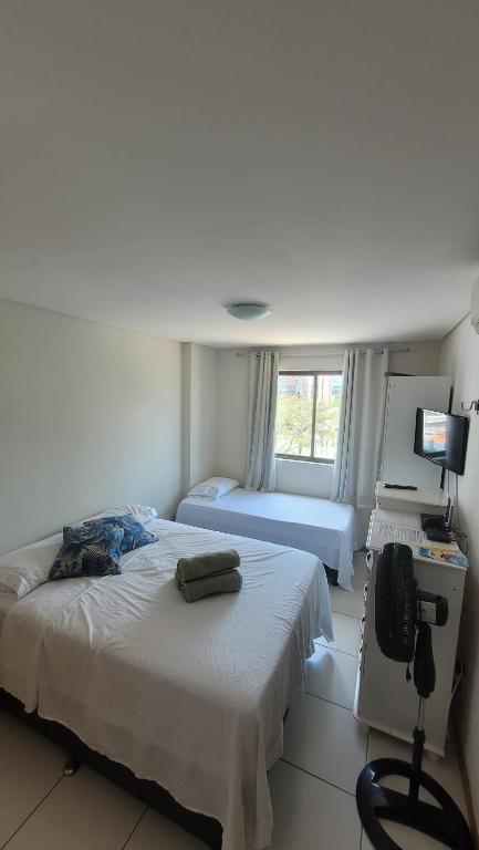 Postel nebo postele na pokoji v ubytování Apto 310 - Residencial Monte Fuji