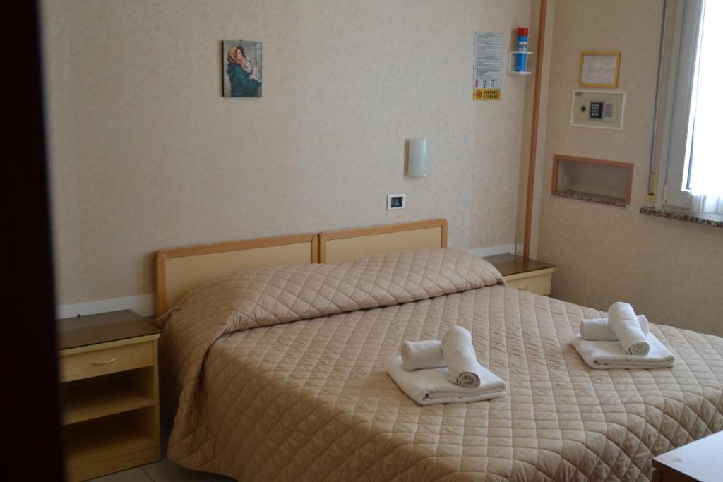 Postel nebo postele na pokoji v ubytování Hotel Bel Sogno