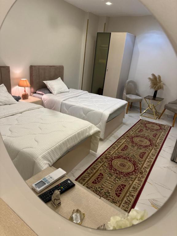 Łóżko lub łóżka w pokoju w obiekcie Hapi Pyramids Hotel