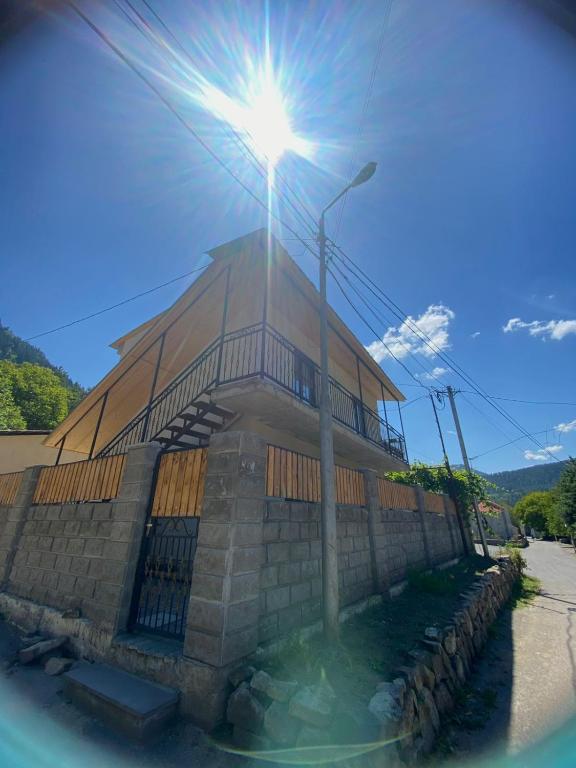 a building with a street light in front of it at Your Cottage in Borjomi