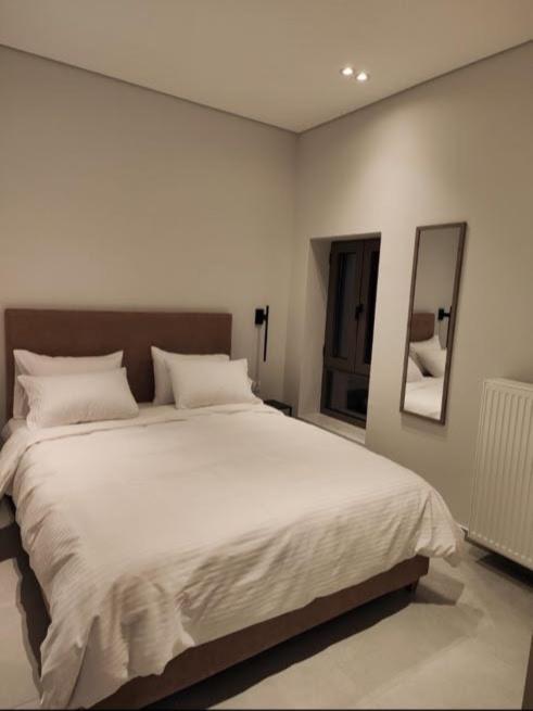 Postel nebo postele na pokoji v ubytování Pavliani Apartments