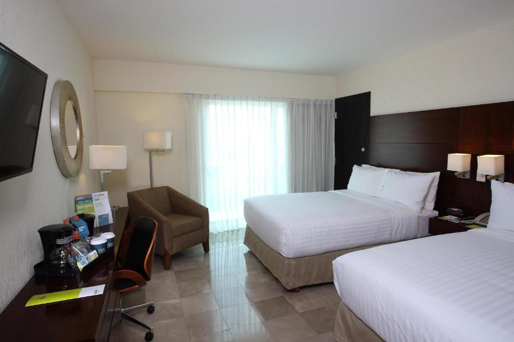 Postel nebo postele na pokoji v ubytování Four Points by Sheraton Veracruz