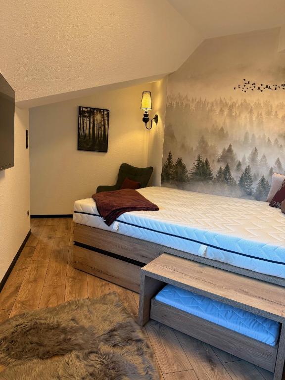 Postel nebo postele na pokoji v ubytování Apartmány KAMZÍK Donovaly