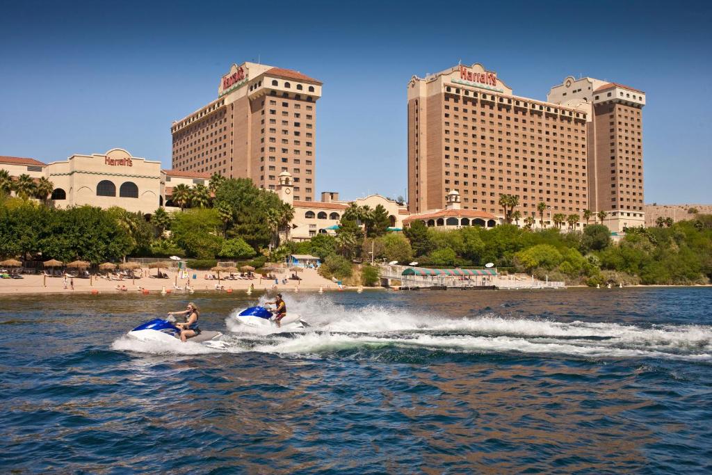 two people on a jet ski in the water at Harrah's Laughlin Beach Resort & Casino in Laughlin