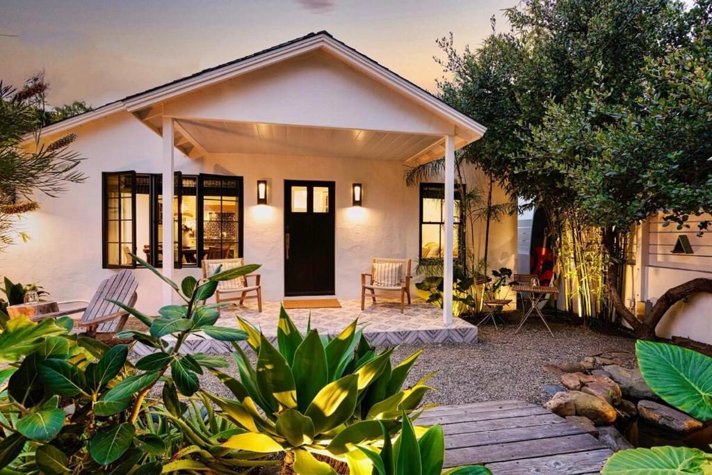 a small white house with a patio in front of it at NiDOMARE - Channel Islands Beach Retreat in Oxnard