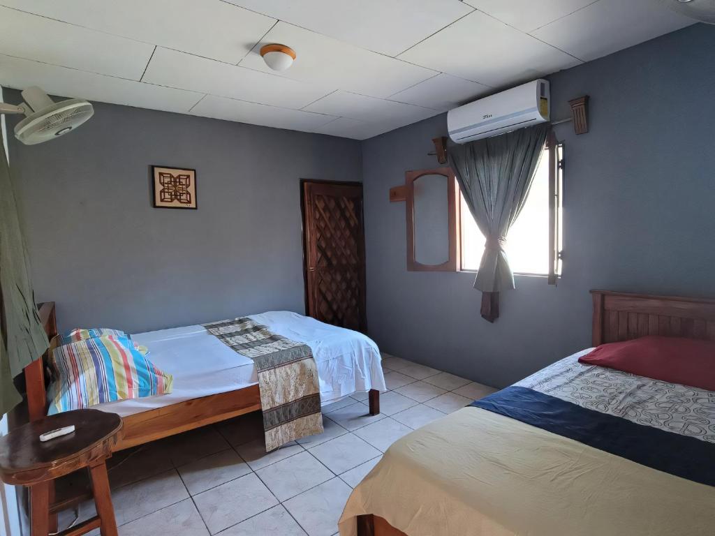 Postel nebo postele na pokoji v ubytování Ometepe House