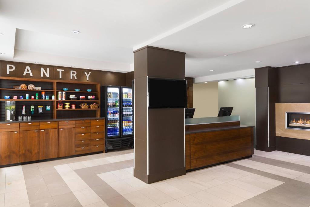 a pantry in a hotel lobby with a pharmacy at Four Points by Sheraton Surrey in Surrey