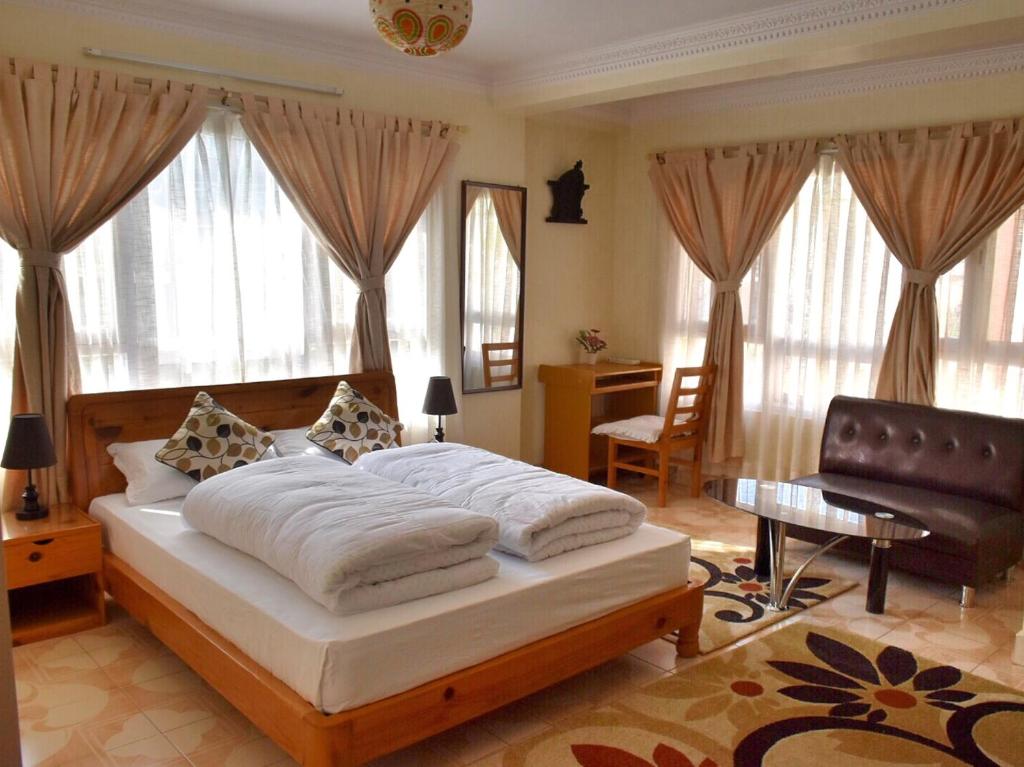 Ένα ή περισσότερα κρεβάτια σε δωμάτιο στο Shakya House