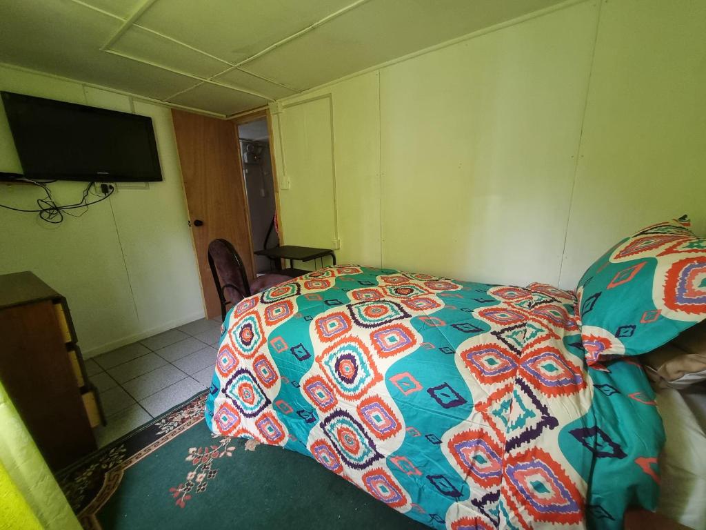 Postel nebo postele na pokoji v ubytování Hospedaje Residencial Atenas