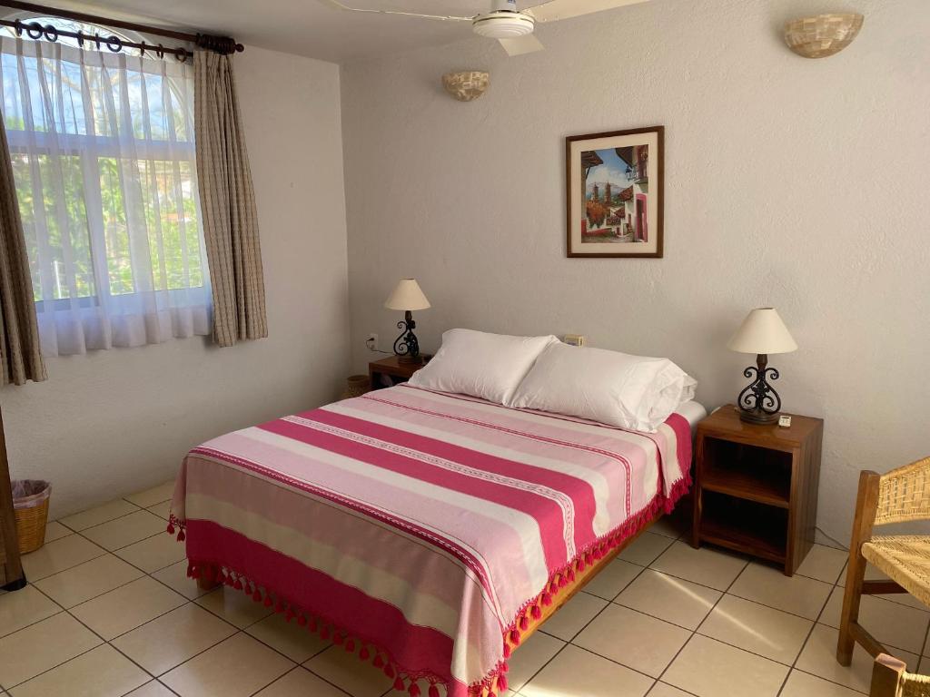 Postel nebo postele na pokoji v ubytování Zandoyo Bed & Breakfast