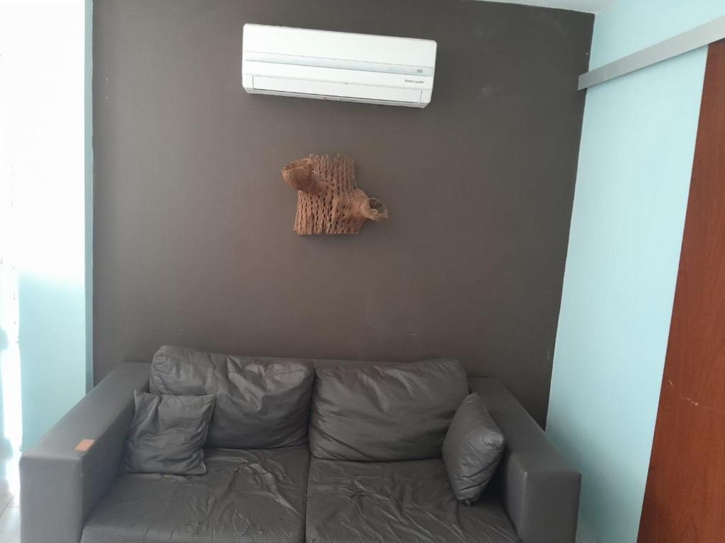 a living room with a couch and a window at Nuevo Amanecer in Villa Los Aromos