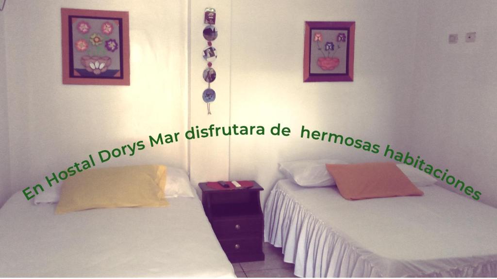 Postel nebo postele na pokoji v ubytování Hostal Dorys Mar