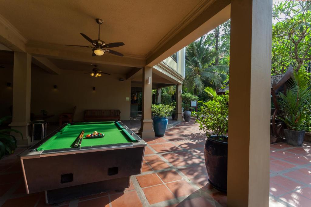 a pool table on a patio at Prince Angkor Hotel & Spa in Siem Reap