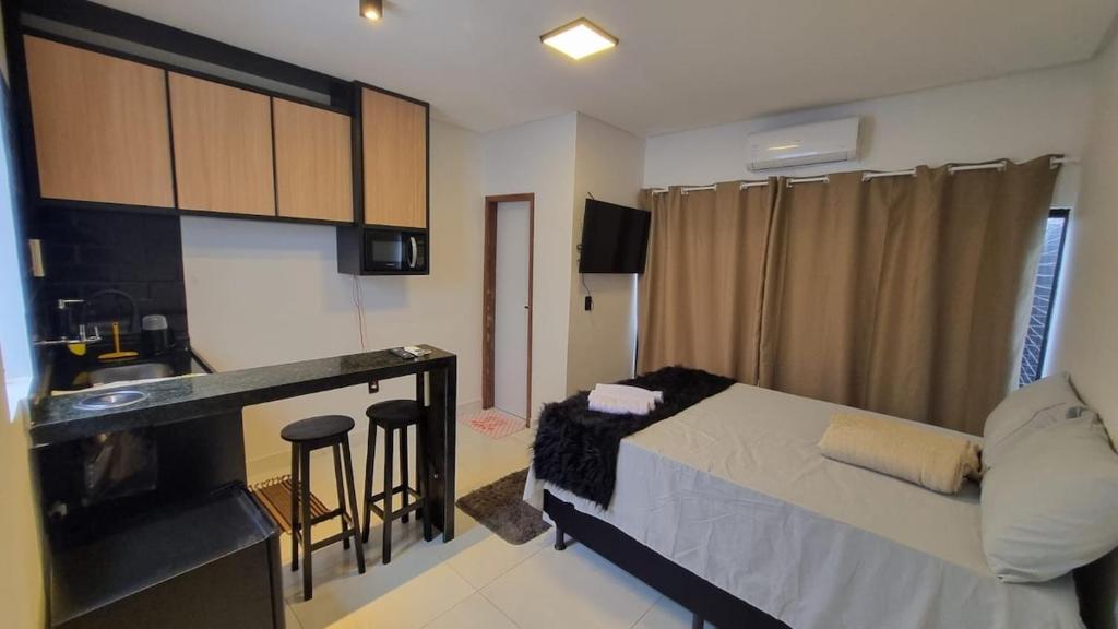 Ένα ή περισσότερα κρεβάτια σε δωμάτιο στο Lofts São João - loft 03