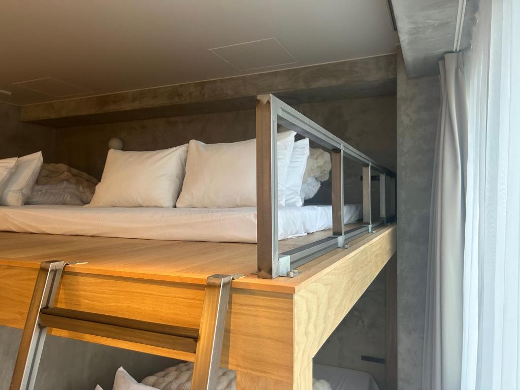 Postel nebo postele na pokoji v ubytování Hotel Ten Tamachi