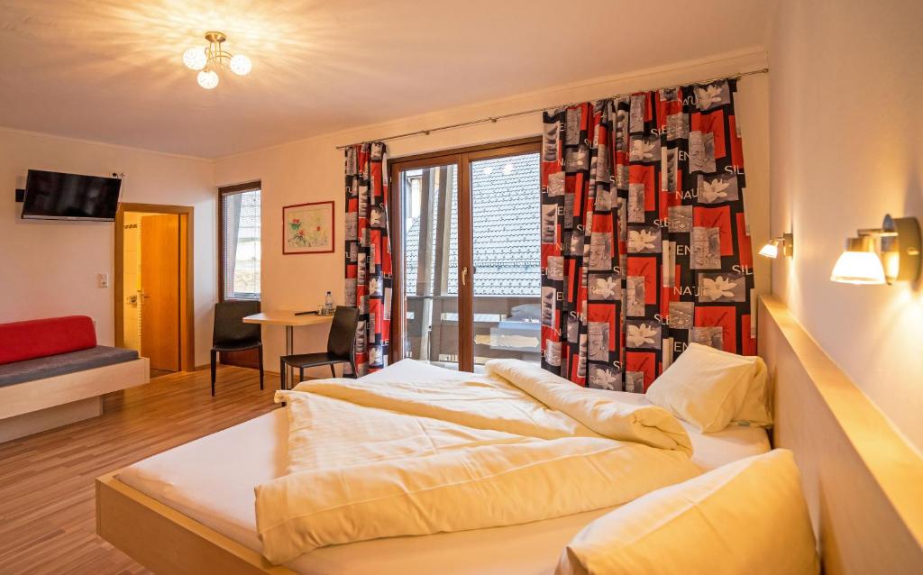 Postel nebo postele na pokoji v ubytování Haus Stampfer