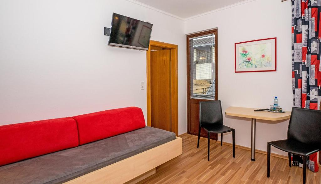 TV a/nebo společenská místnost v ubytování Haus Stampfer
