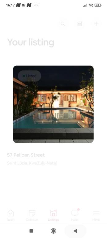 a page of a website with a picture of a building at 57 Pelican Street in St Lucia