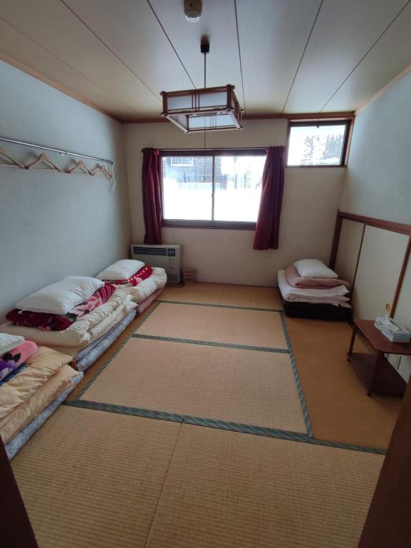 Postel nebo postele na pokoji v ubytování PEUF Lodge