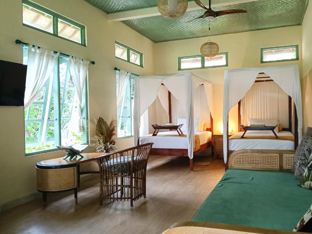 Postel nebo postele na pokoji v ubytování Aashaya Jasri Resort