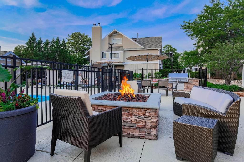 a patio with chairs and a fire pit at Residence Inn Chicago Deerfield in Deerfield