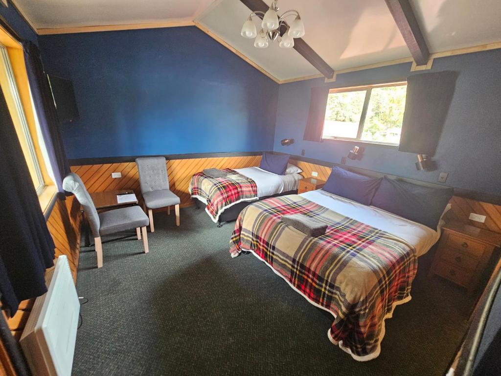Voodi või voodid majutusasutuse Chateau Backpackers & Motels toas
