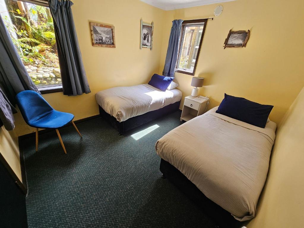 Voodi või voodid majutusasutuse Chateau Backpackers & Motels toas