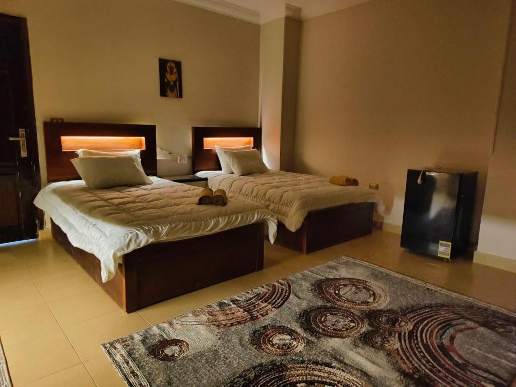 Voodi või voodid majutusasutuse Akh Pyramid Hostel toas