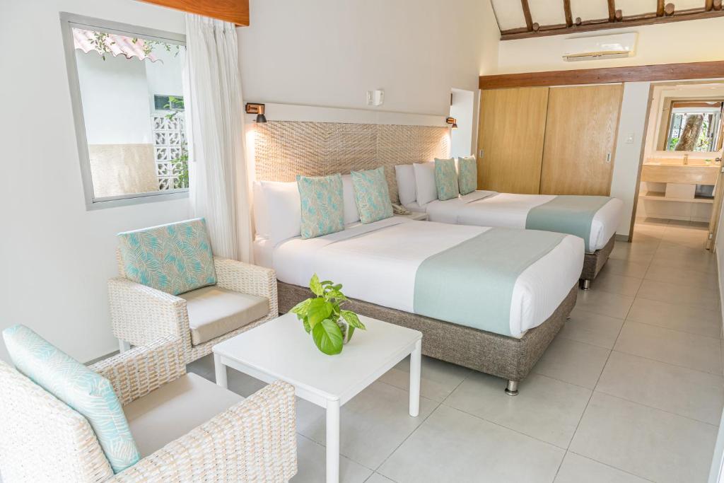 Postel nebo postele na pokoji v ubytování Hotel Irotama Bungalows & Bohios
