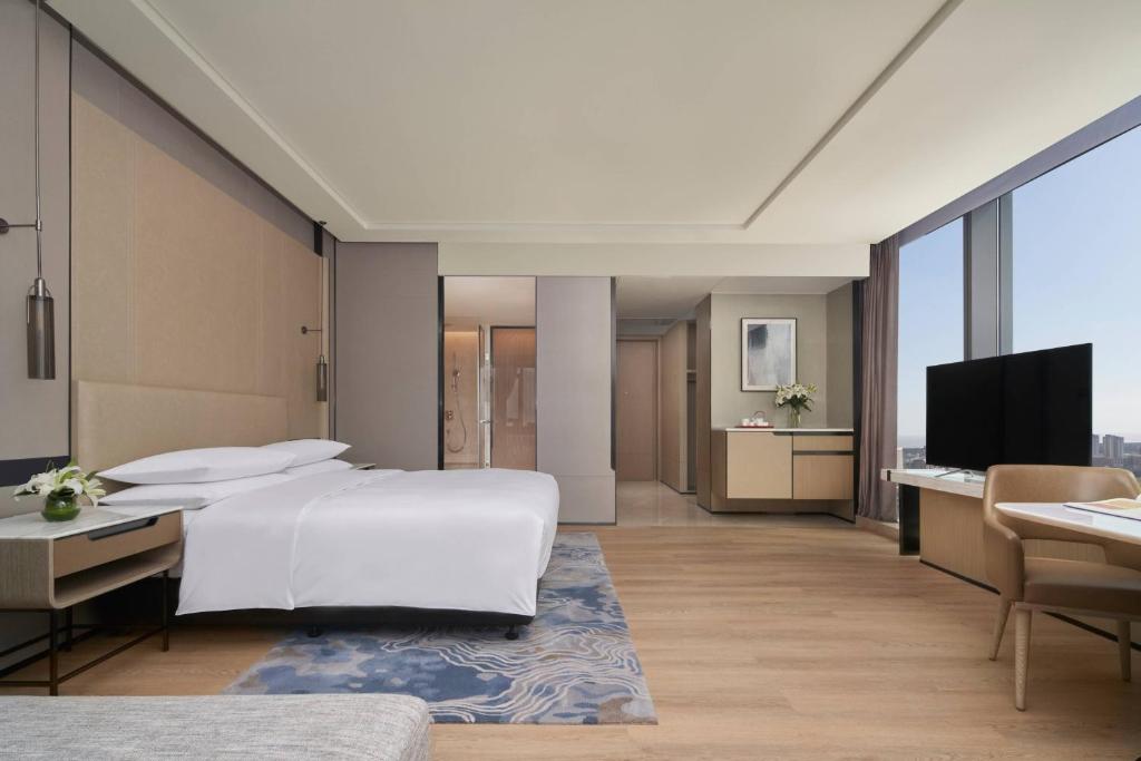 Postel nebo postele na pokoji v ubytování Fuzhou Marriott Hotel Riverside