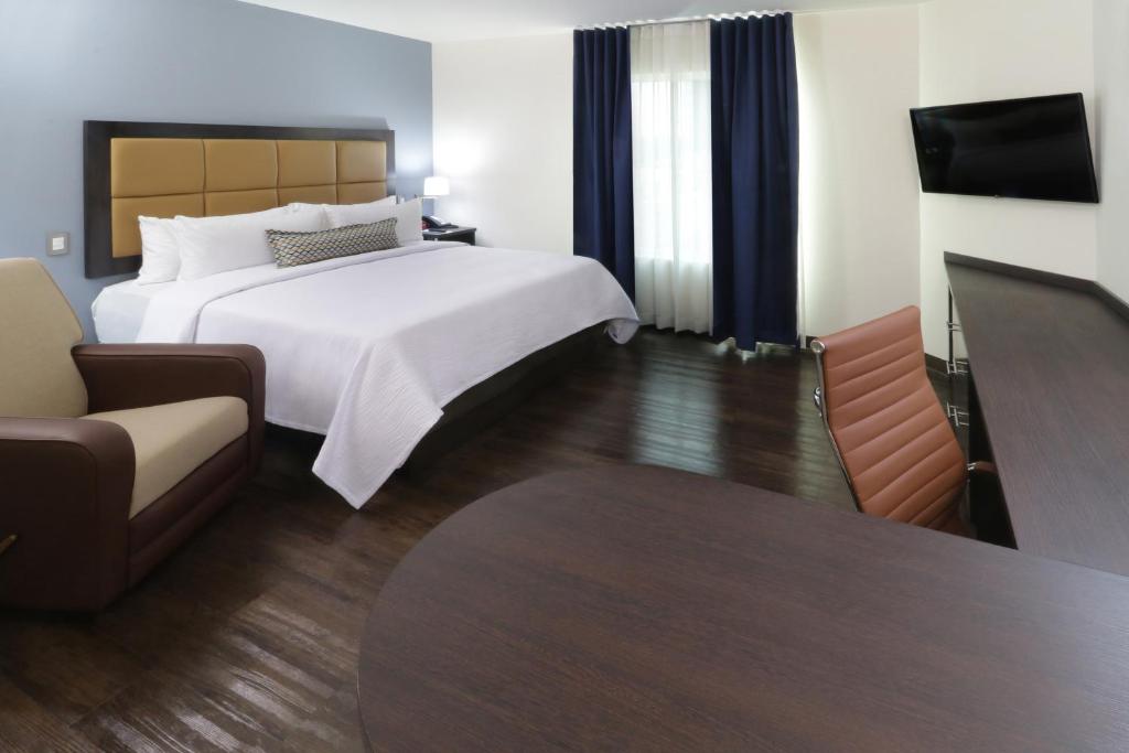 Postel nebo postele na pokoji v ubytování Candlewood Suites - Queretaro Juriquilla by IHG